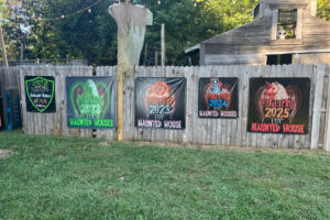 Madhaunter's Madhouse Top Haunted House banners on display at the Madhaunters Haunted House.